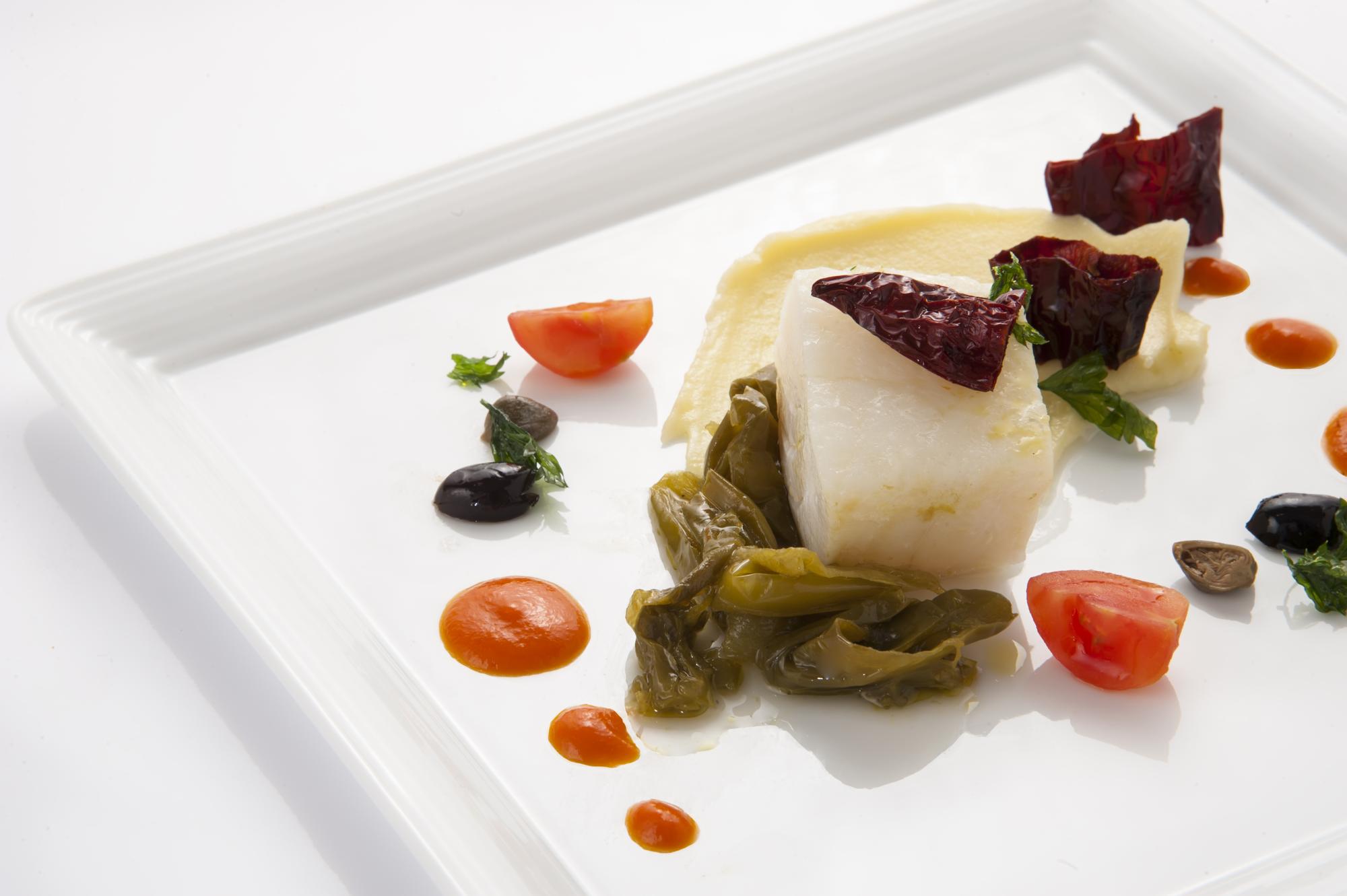 Plated dish with pickled garnish